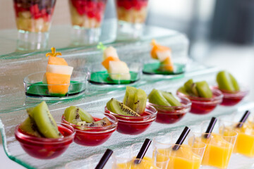 a table topped with cups filled with desserts. hotel conference coffee break idea 