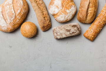 Homemade natural breads. Different kinds of fresh bread as background, top view with copy space