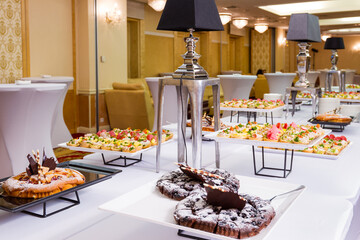 a buffet table with a variety of pastries on it. hotel conference coffee break idea