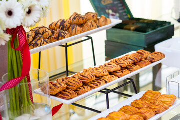 a table with a bunch of pastries on it. hotel conference coffee break idea
