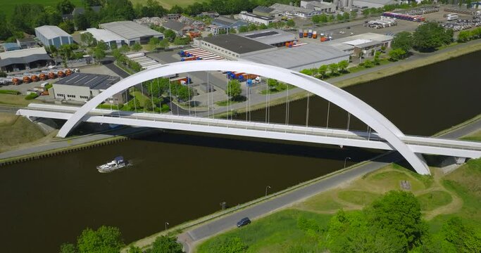 Aerial Orbit Around Modern White 'Bert Swart' Arch Train Bridge in Zuidhorn, Netherlands