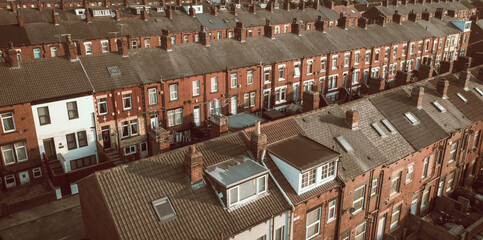 Aerial view above rows of back to back terraced houses
