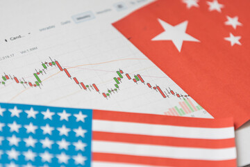 Abstract virtual financial graph hologram on USA flag and sunset sky background, forex and investment concept. Multiexposure