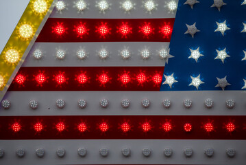 Neon sign symbolizing the US flag. White red and blue light. The joy and energy of the people of the United States.
