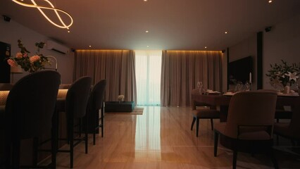 camera movement The room in the condominium, through the dining table, kitchen, living sofa while the curtain is slowly opening.