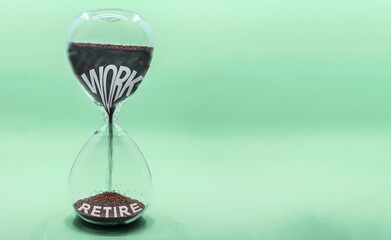 Fototapeta na wymiar Work and retire words inside an hourglass. Suitable for concepts as countdown working and retirement, money saving ,investment and health insurance