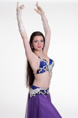 Belly dancer woman studio photography, belly dance is an art form of the dance.