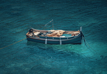 Fototapeta na wymiar small fisherboat in the blue ocean