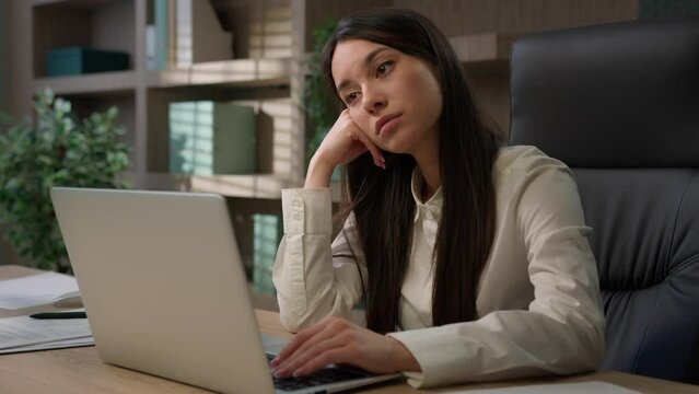 Bored sad upset tired exhausted Caucasian female office worker girl fatigued unmotivated business woman manager disinterested boring laptop work lazy businesswoman thinking boredom working burnout