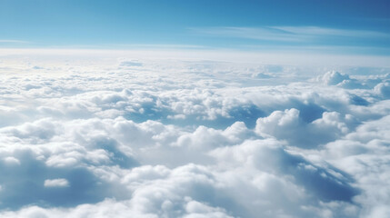 Naklejka na ściany i meble Blue sky with white clouds.Panoramic view above the clouds.Concept of heaven and earth.