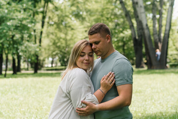 Obraz premium portrait of a couple in love a man and a pregnant woman are hugging, waiting for a new addition to the happy family