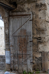 Medieval door in city wall of old town in Rhodes, Greece