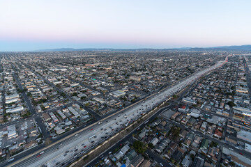 Dawn aerial view of the Harbor 110 freeway near Florence Ave south of downtown Los Angeles in Southern California.  