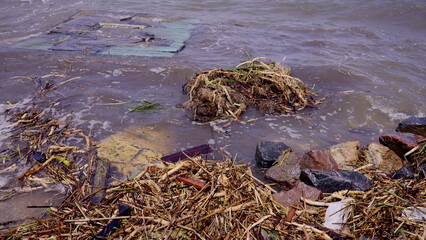 Part of wall of house floats near shore, floating debris has reached Black Sea beaches in Odessa, Ukraine. Environmental disaster caused by explosion of Kakhovka Hydroelectric Power Plant dam, closeup