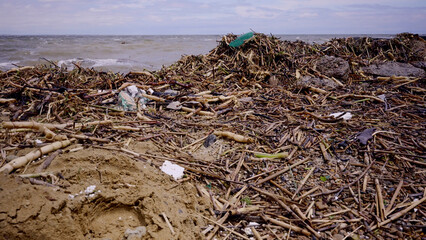 Plastic and other drifting debris has reached Black Sea beaches in Odessa, Ukraine. Environmental disaster caused by the explosion of Kakhovka Hydroelectric Power Plant dam, Close-up