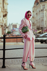Fashionable elegant confident woman wearing trendy pink sunglasses, headscarf, suit blazer,...