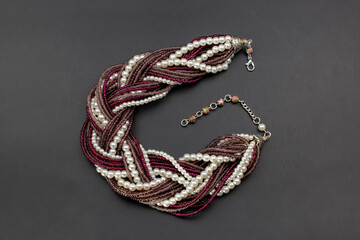 Purple beads and pearls necklace on black, unique handmade jewelry background