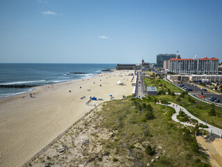 Asbury Park beach and boardwalk taken from above by a drone - obrazy, fototapety, plakaty