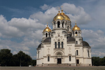 The sun is shining, the domes are shining with gold, and around are white clouds, the yellow walls of the temple, the square, the person, everything is fleeting, sunset will come after sunrise, sunris