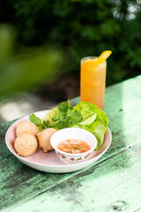 Outdoor Sunny Day Meal of Asian Fried Food with Tropical Cocktail Drink