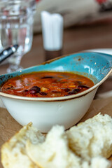 Minestrone Soup is a thick soup of Italian origin made with vegetables, often with the addition of pasta or rice