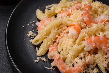 Delicious fresh penna pasta with shrimp, sauce, cheese, salt and spices