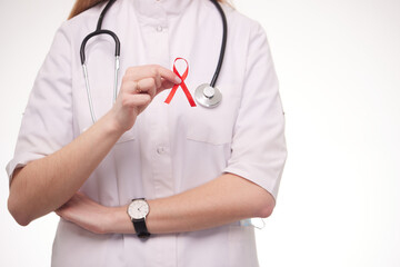 international symbol of the fight against AIDS, a doctor holds a symbol of awareness of people with problems