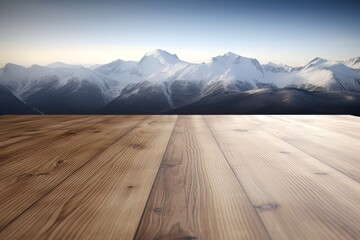 Empty brown wooden table top against winter snowy high mountains and blue sky