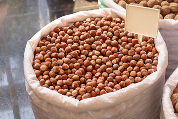 Hazelnuts in a big bag. Hazelnut background, healthy food