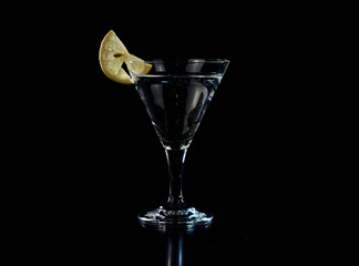 A martini glass cocktail with citrus fruit