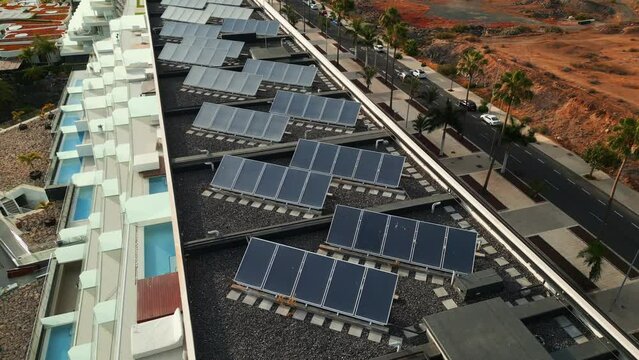 solar panel farming on roof of hotel, resort, house or residential building