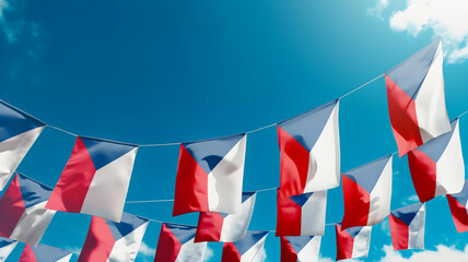 Flag of Czech against the sky, flags hanging vertically