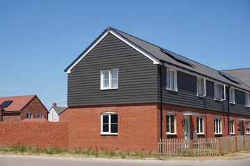 New build houses on residential street. Modern new homes in the UK. Property development 