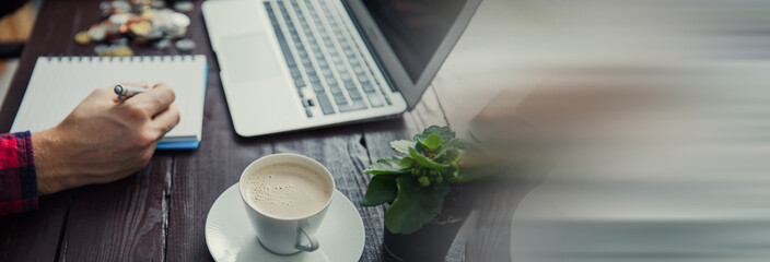 man hand notepad with coffee and keyboard