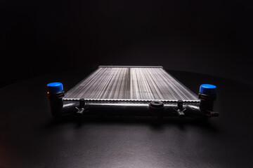 a new aluminum radiator for cooling antifreeze in the car engine