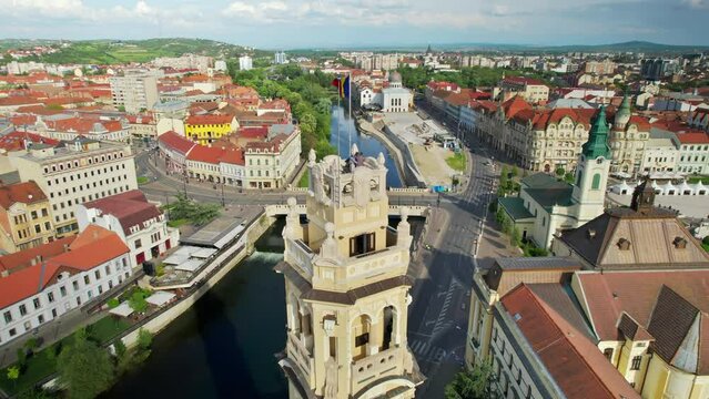 Areal drone view of City Hall Tower in Oradea downtown, Romania. People on top on the tower located on the Unirii Square