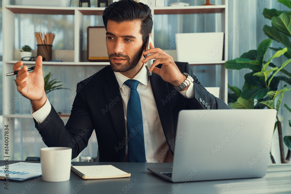 Aufkleber diligent businessman busy talking on the phone call with clients while working with laptop in his of