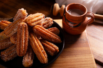 Churros. Fried wheat flour dough, a very popular sweet snack in Spain, Mexico and other countries where it is customary to eat them for breakfast or snack accompanied by hot chocolate or coffee.