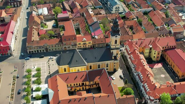 Areal drone view of the Cathedral of St. Nicholas in Oradea downtown, Romania. Unirii Square and historical buildings around