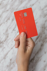 buying with a rectangular and colorful credit card, lifestyle and financial credit, objects in...