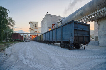 Freight gondola cars for limestone loading stand at factory