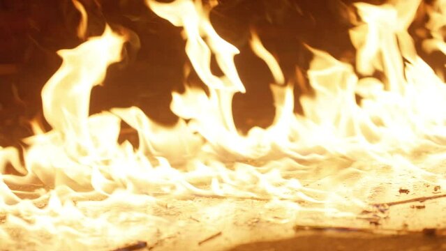 Lit match dropping on gasoline causing fire