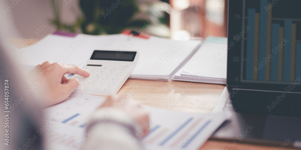 Leinwandbilder statistical analyst reading graph report and business statistics charts ,Analysis and improvement of corporate strategy ,manage financial and marketing documents ,Statistics and Data Concepts