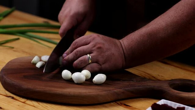appetizer, chef, cook, garlic, kitchen, cutting board, chopping, natural, wood, salad, person, preparing, rustic, simple, Mediterranean, cuisine, home decor, interior design,