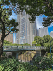Obraz na płótnie Canvas Urban landscape gardening central park city downtown Tokyo with flowers on bloom, trees and floral nature scenery peaceful tranquil recreation