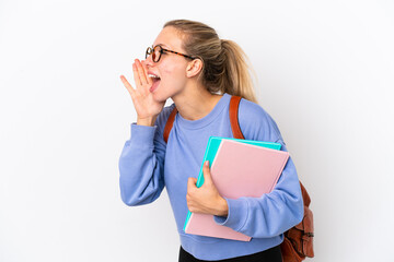 Young student caucasian woman isolated on white background shouting with mouth wide open to the side