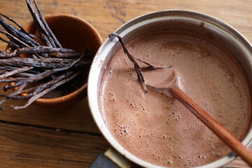 Preparing hot chocolate with vanilla beans