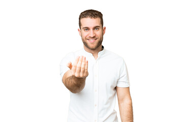 Young handsome blonde man over isolated chroma key background inviting to come with hand. Happy...