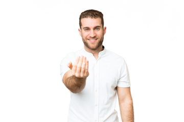 Young handsome blonde man over isolated chroma key background inviting to come with hand. Happy that you came