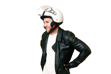 Young handsome blonde man with a motorcycle helmet over isolated chroma key background suffering from backache for having made an effort